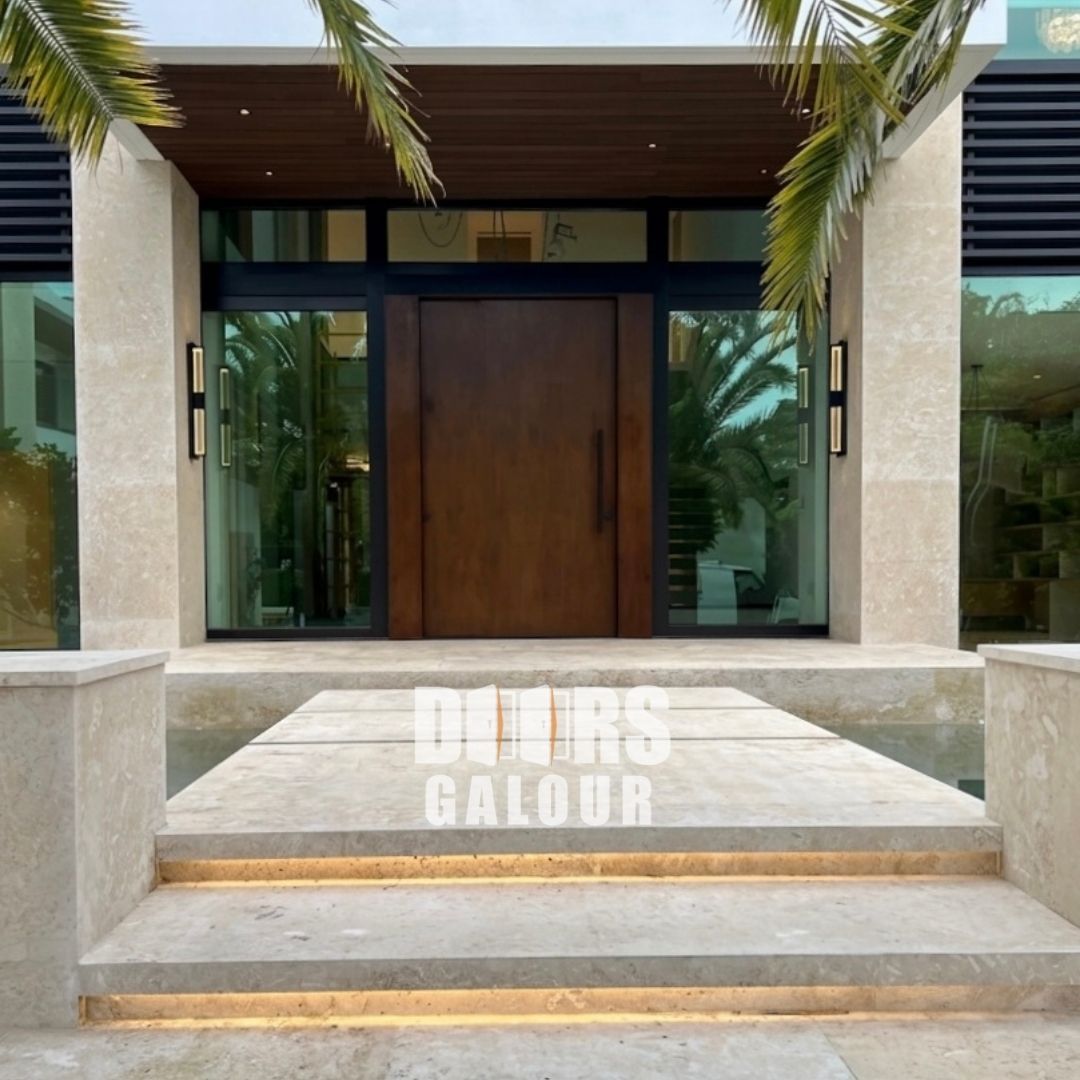 Modern house entrance with wooden double doors, glass sidelights, and stone steps under a covered porch
