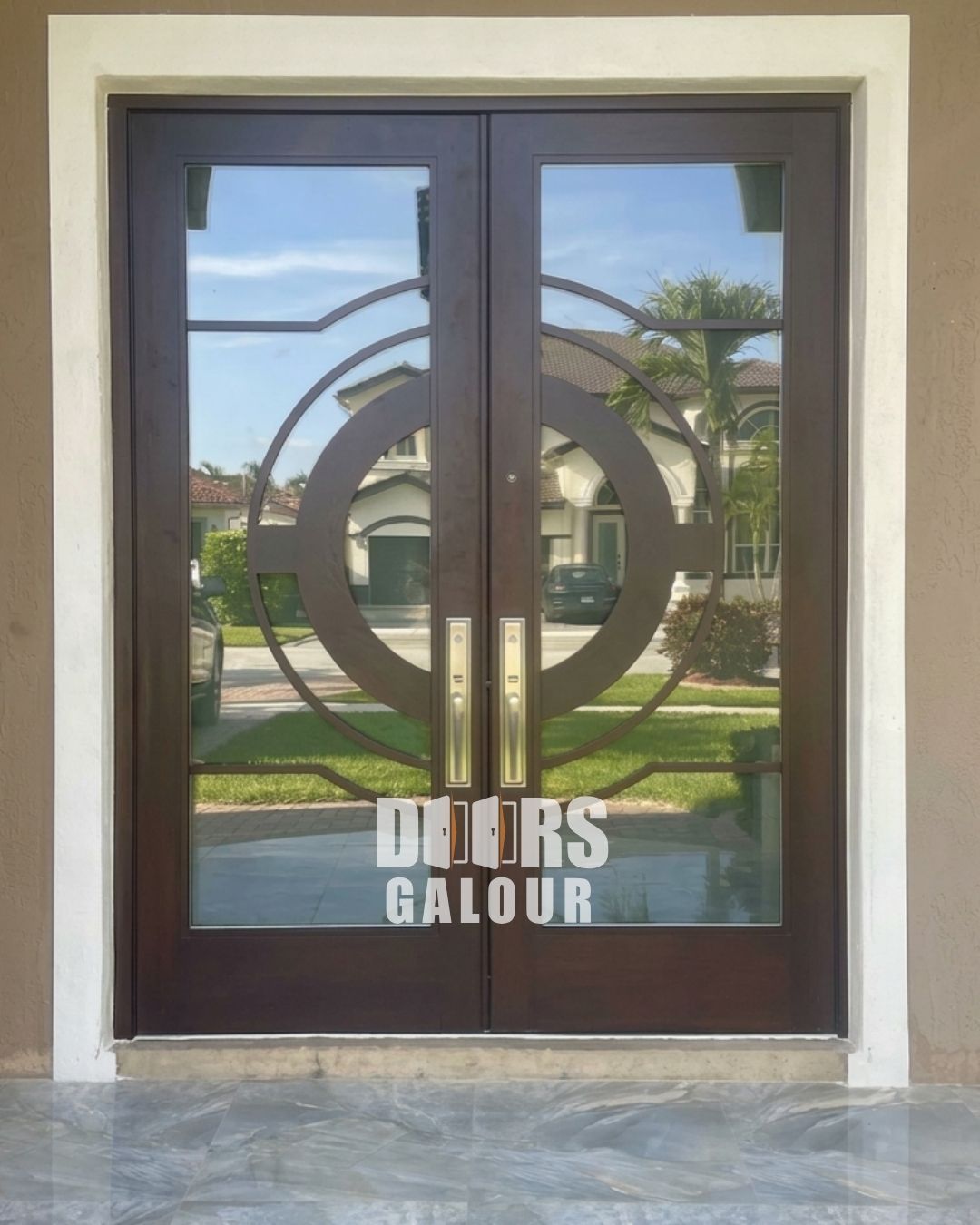 Gray double Fiberglass doors on a house with a tiled entrance and a mailbox.