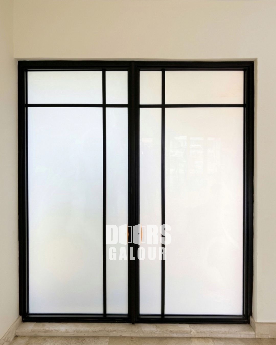 Newly installed window in a concrete wall, with unfinished stucco surrounding it.