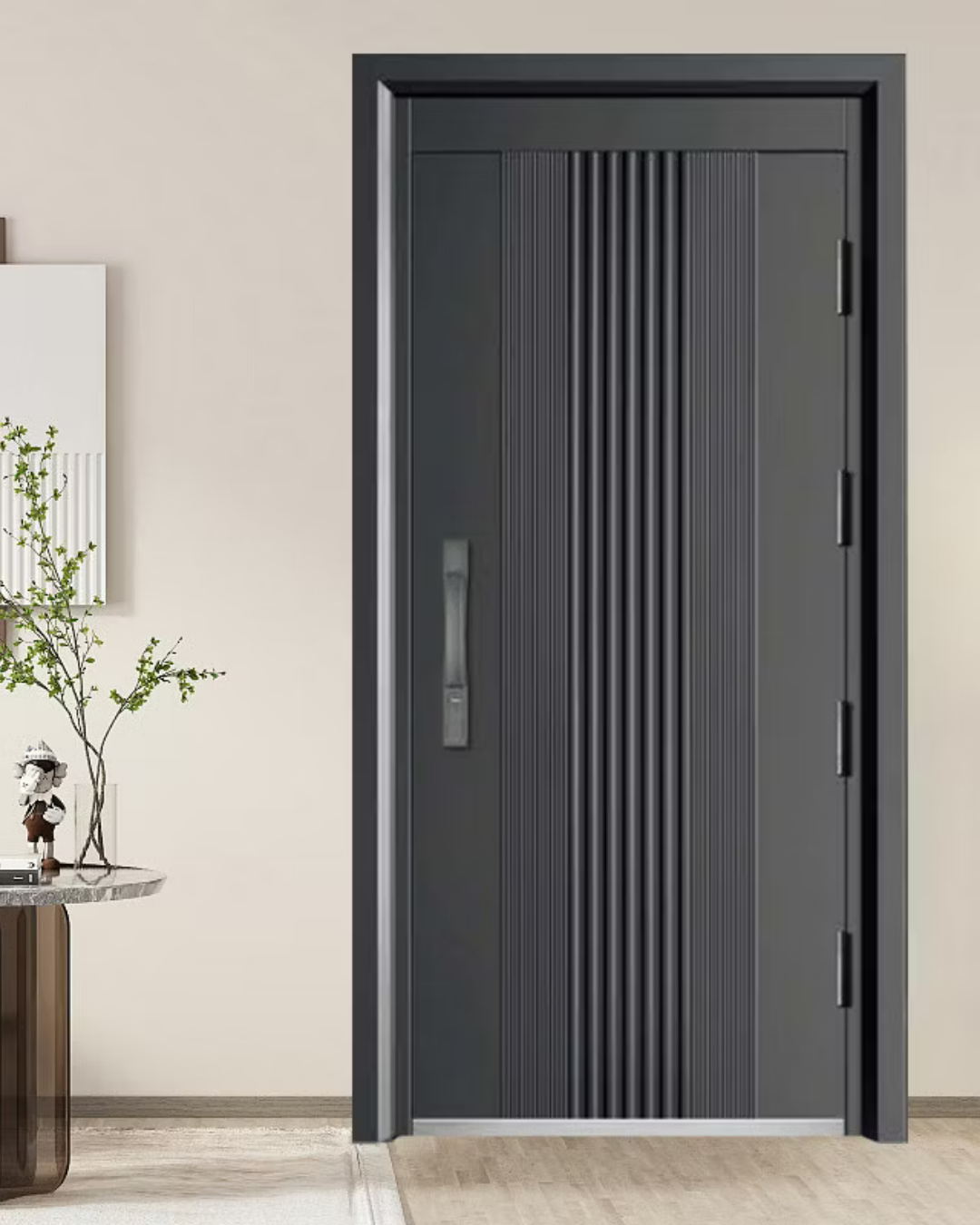 A matte dark grey interior door with vertical ribbed panels, a slim handle, and visible hinges, set in a light room.