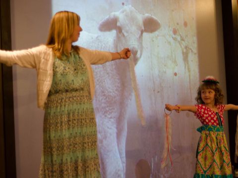 a childrens pastor dancing with a child at a childrens ministry event in wylie tx