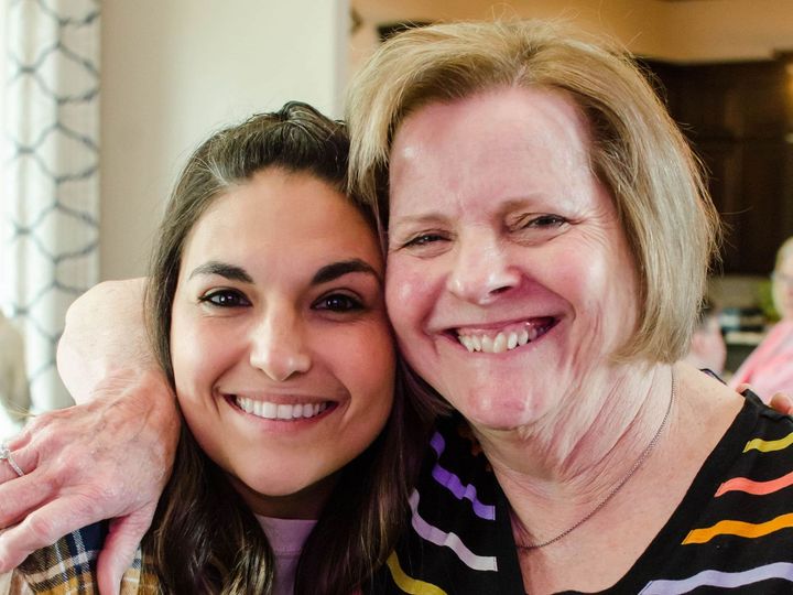 2 adult women at a womens ministry event smiling at the camera