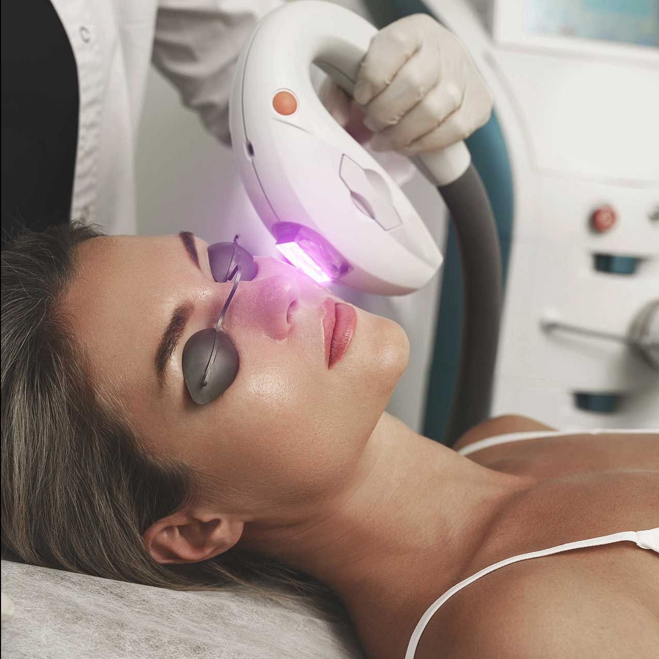 Woman client during IPL treatment in a cosmetology clinic
