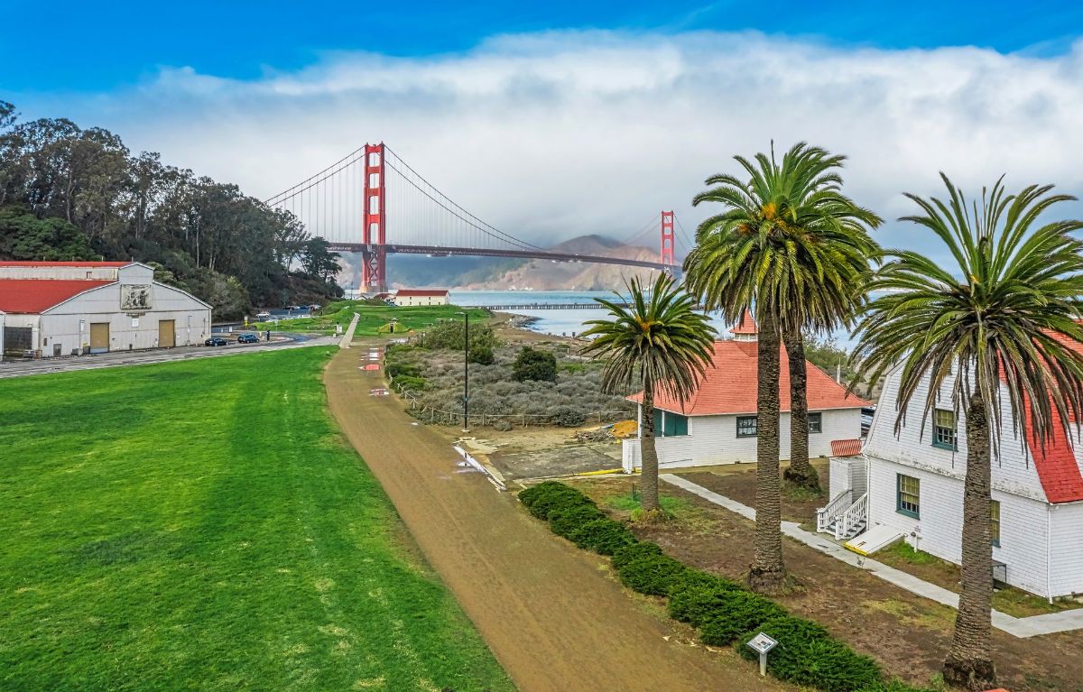 There is a bridge in the background and a house in the foreground.