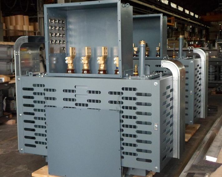 Special execution oil transformer with protection grid fins.