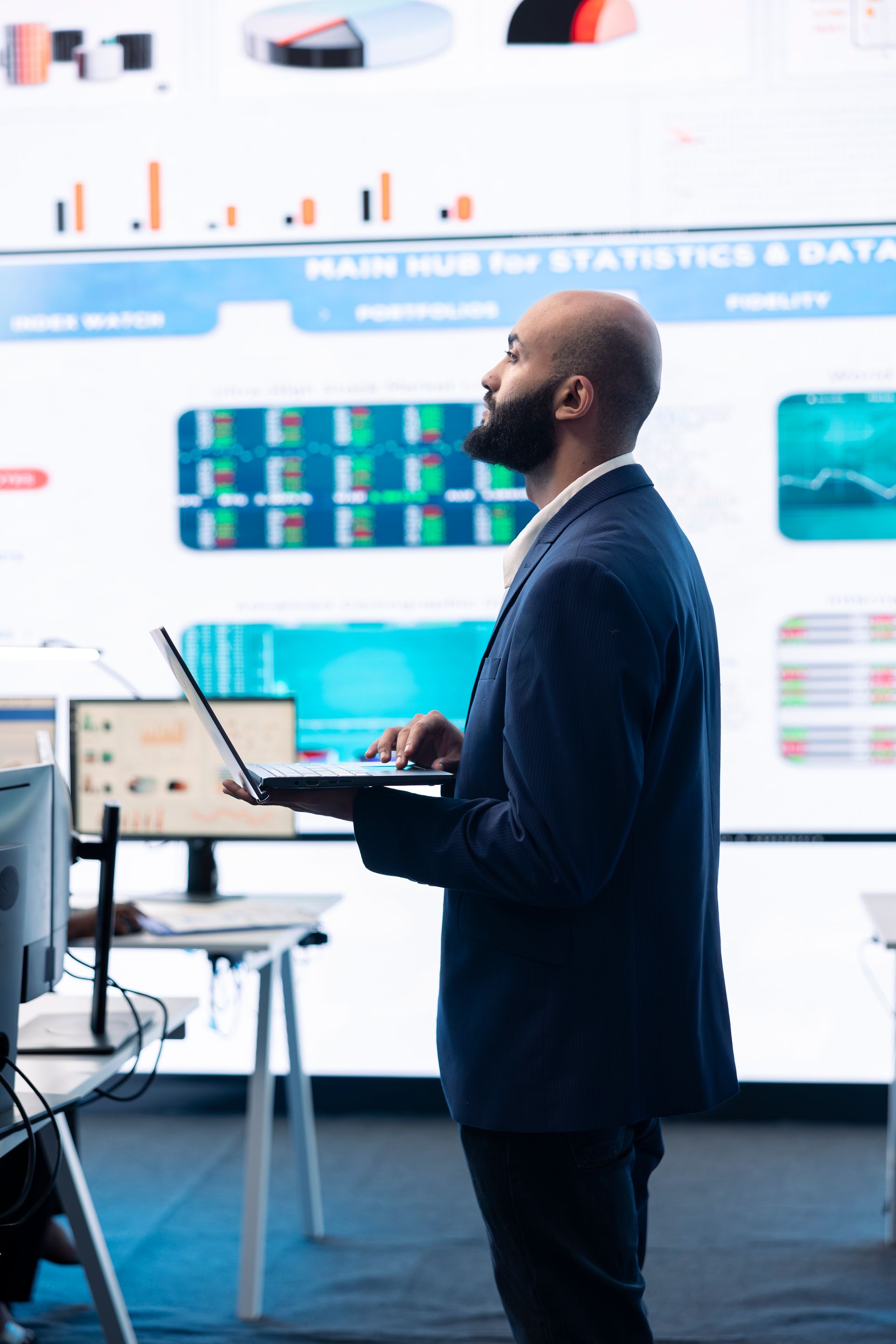 Business team reviewing documents at a table, pointing and discussing strategies.