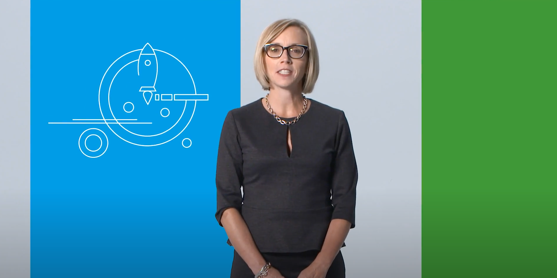 Woman in glasses standing in front of blue and green background with a rocket graphic.