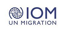 The logo for iom un migration is a blue logo with a globe on it.
