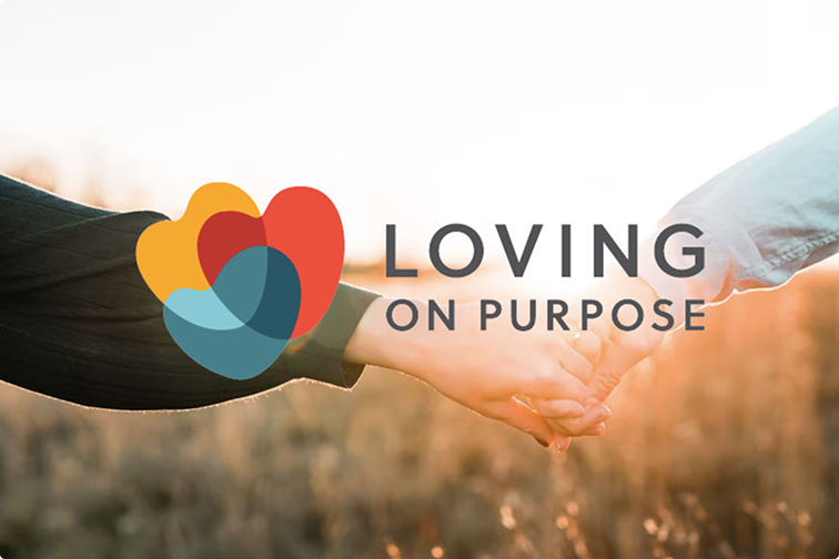 Two hands meeting over a field with the Loving on Purpose logo and text