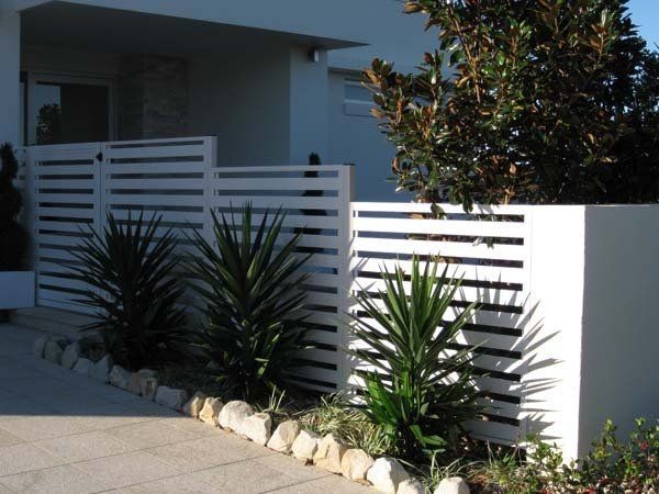 White Slat Fence with Yucca Plants — Precision Patios Toowoomba In Toowoomba, QLD