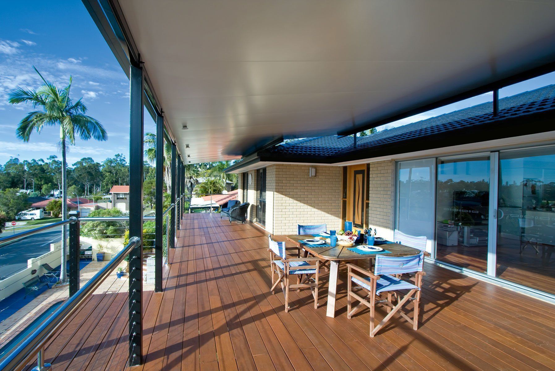Covered Wooden Deck with Table and Chairs — Precision Patios Toowoomba In Toowoomba, QLD