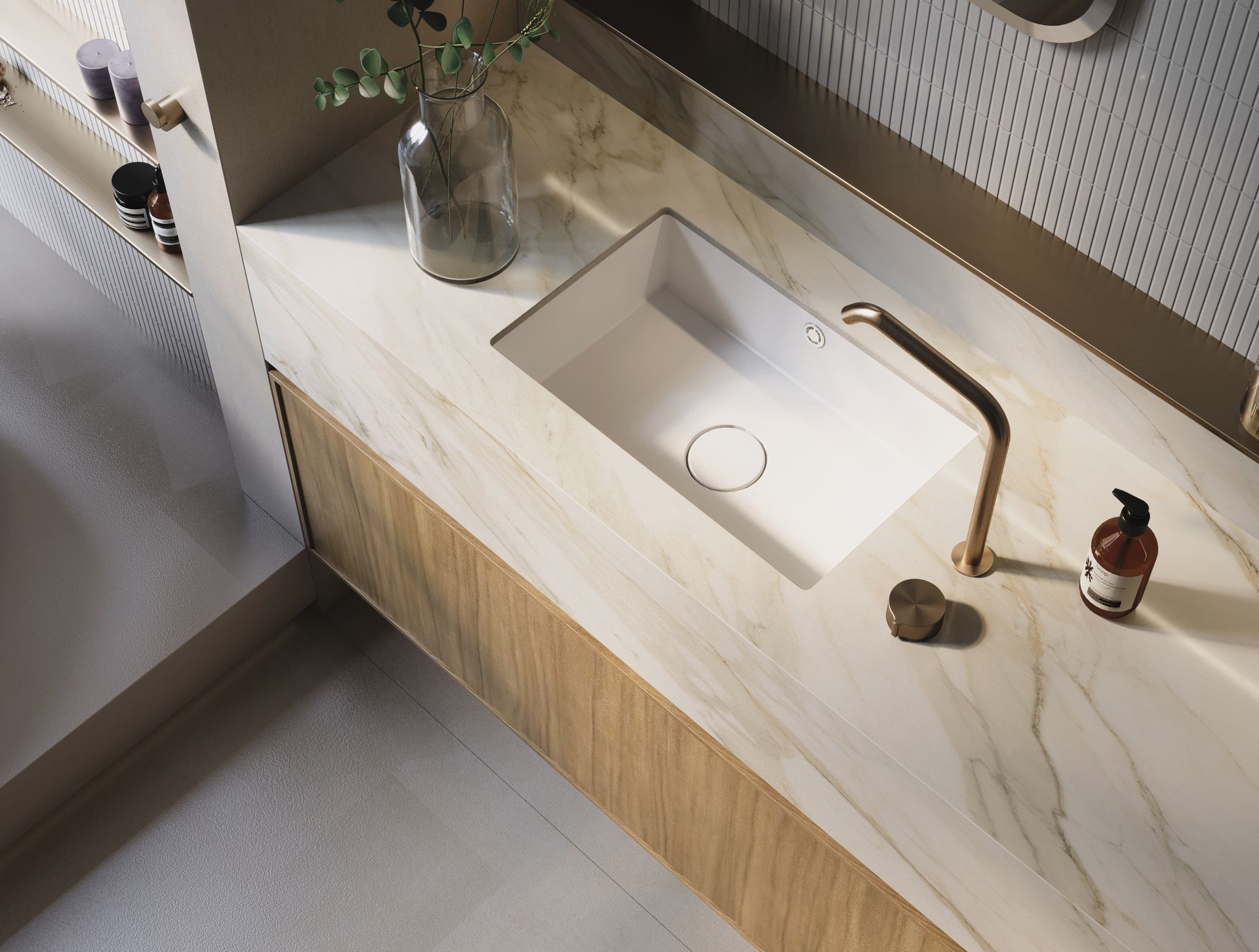 Modern bathroom vanity with white sink, brass faucet, marble countertop, and wood cabinet front