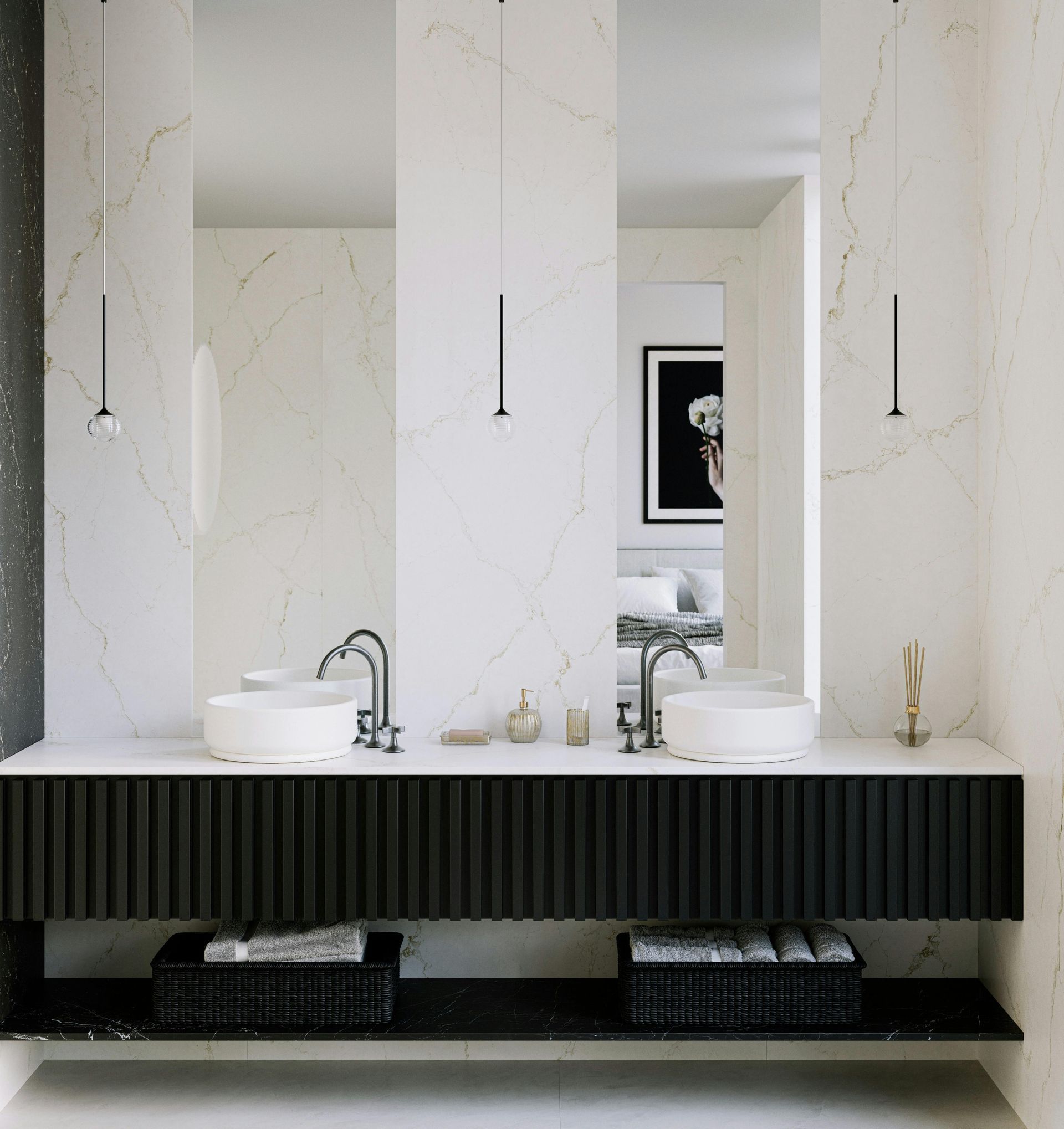Modern white kitchen with marble island, black pendant lights, and matching marble backsplash