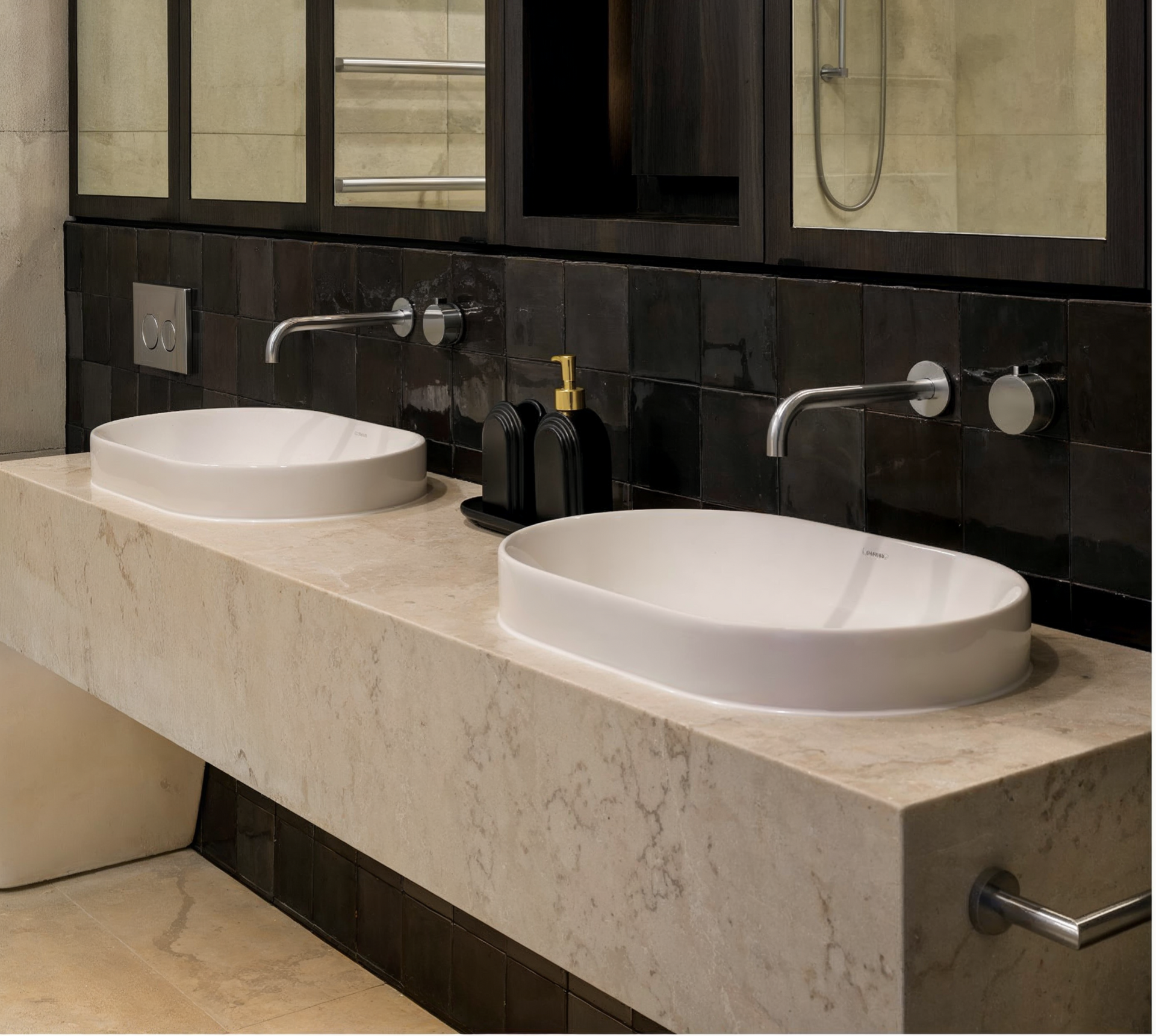 Modern bathroom vanity with two white vessel sinks and dark tile backsplash