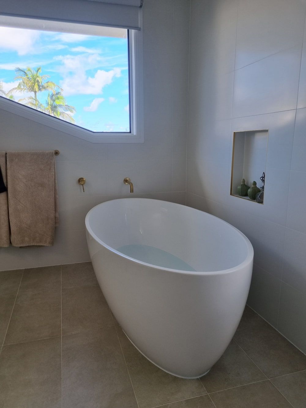 A Bathroom with A Bathtub and A Window — Origin Plumbing & Gas in Brunswick Heads, NSW