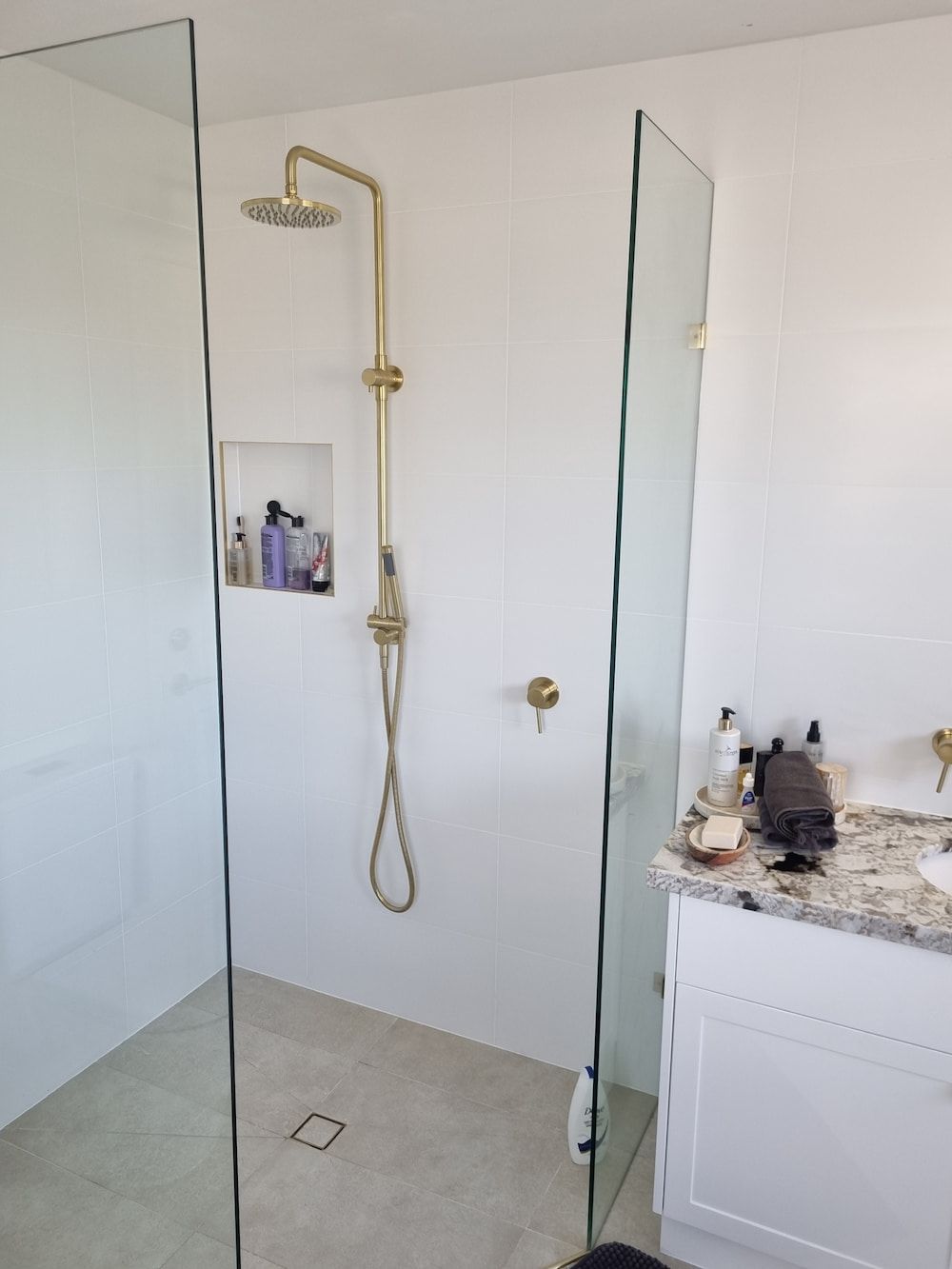 A Bathroom with A Walk in Shower and A Sink — Origin Plumbing & Gas in Tuckurimba, NSW
