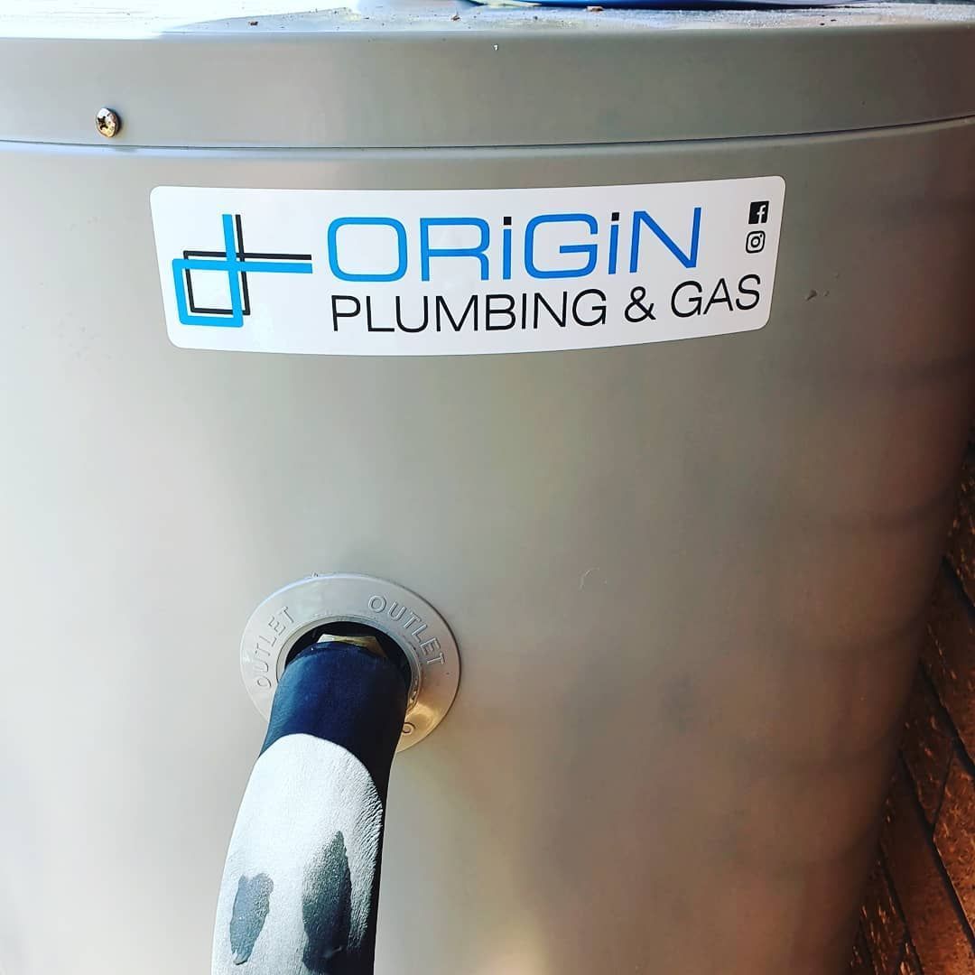 A Water Heater with A Sticker on It that Says Origin Plumbing & Gas — Origin Plumbing & Gas in Tuckurimba, NSW
