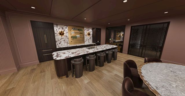 Club room kitchen with a marble island and bar seating