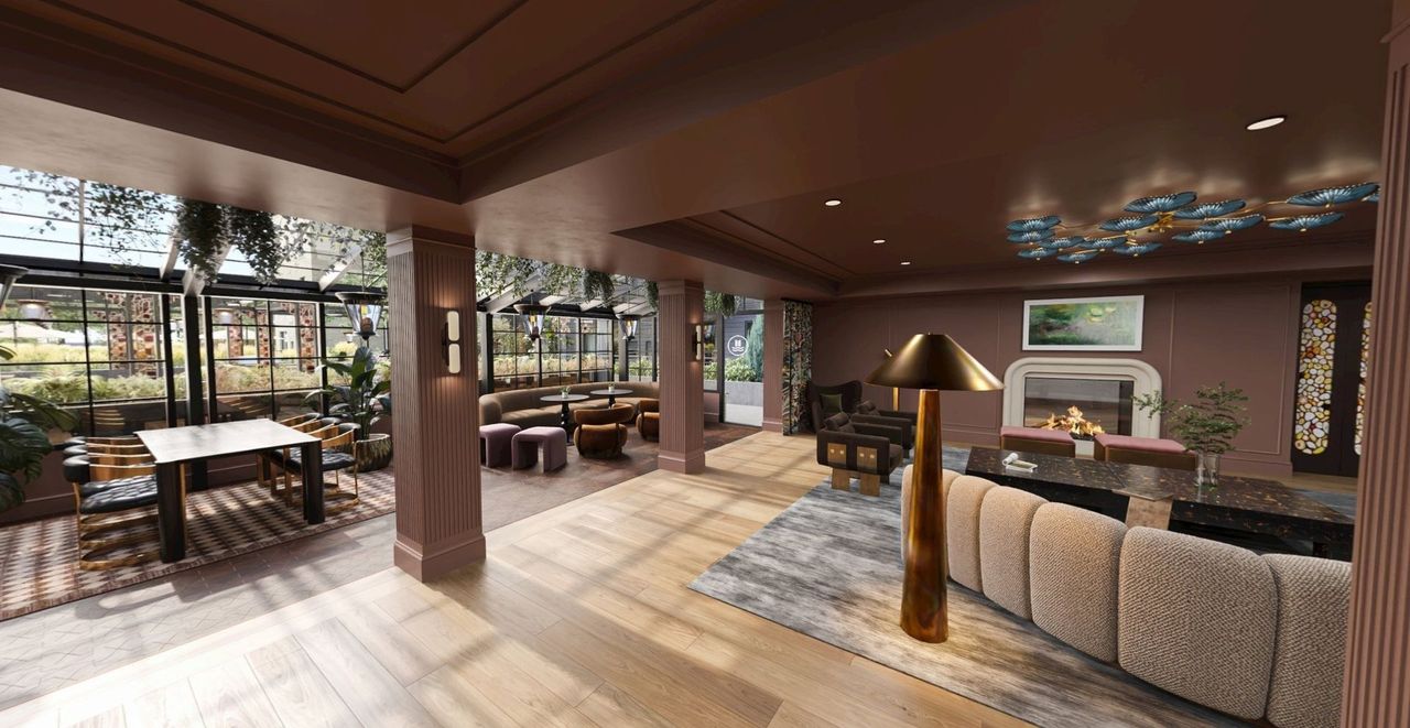 Club room lounge with a fireplace and views into the conservatory