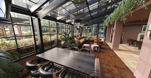 Communal dining table in the glass conservatory