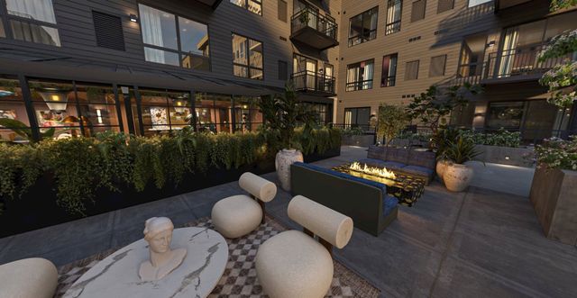 Fire pit seating outside the glass conservatory