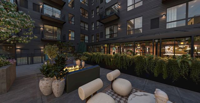 Courtyard fire pit lounge at dusk