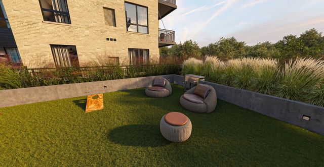 Courtyard lawn with lounge chairs and yard games