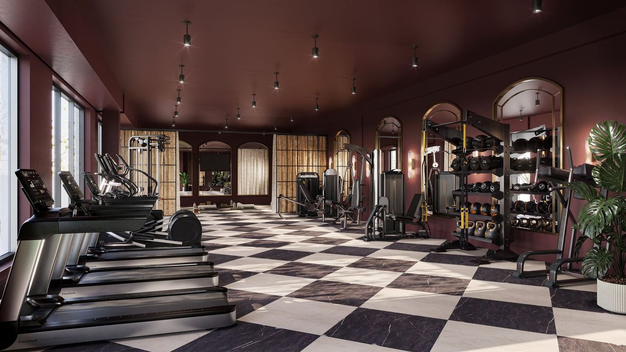 Fitness center at The Setting with cardio machines, strength equipment, and arched mirrors