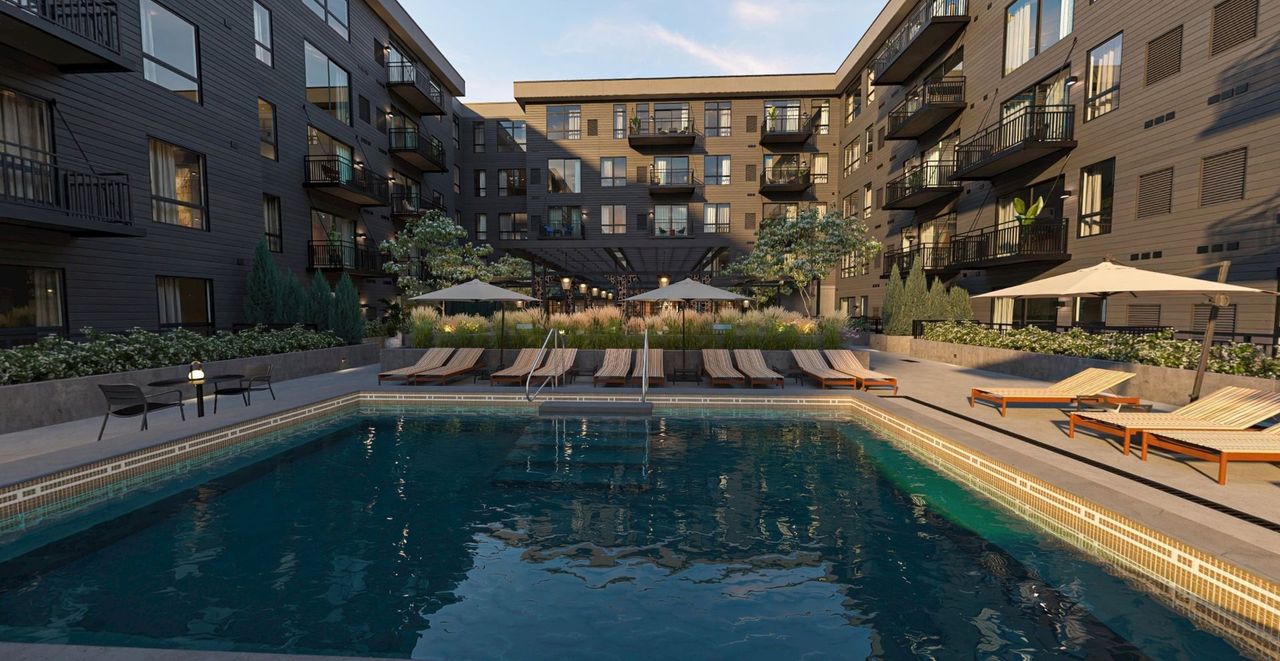 Seasonal pool with lounge chairs in the courtyard at The Setting