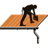 Worker installing solar panels on a rooftop, holding a tool on an orange panel