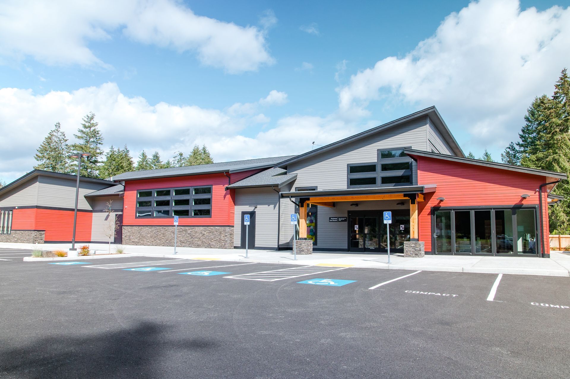 A large building with a parking lot in front of it