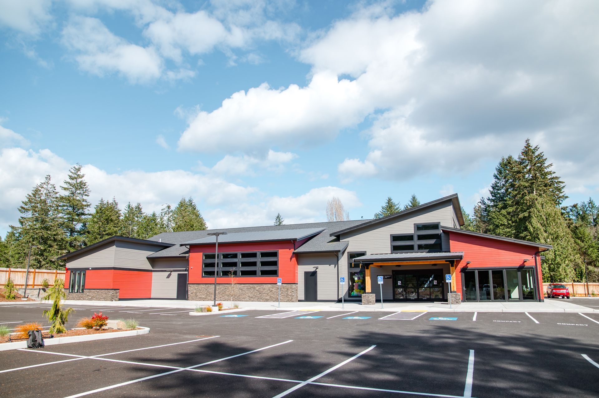 A large building with a parking lot in front of it