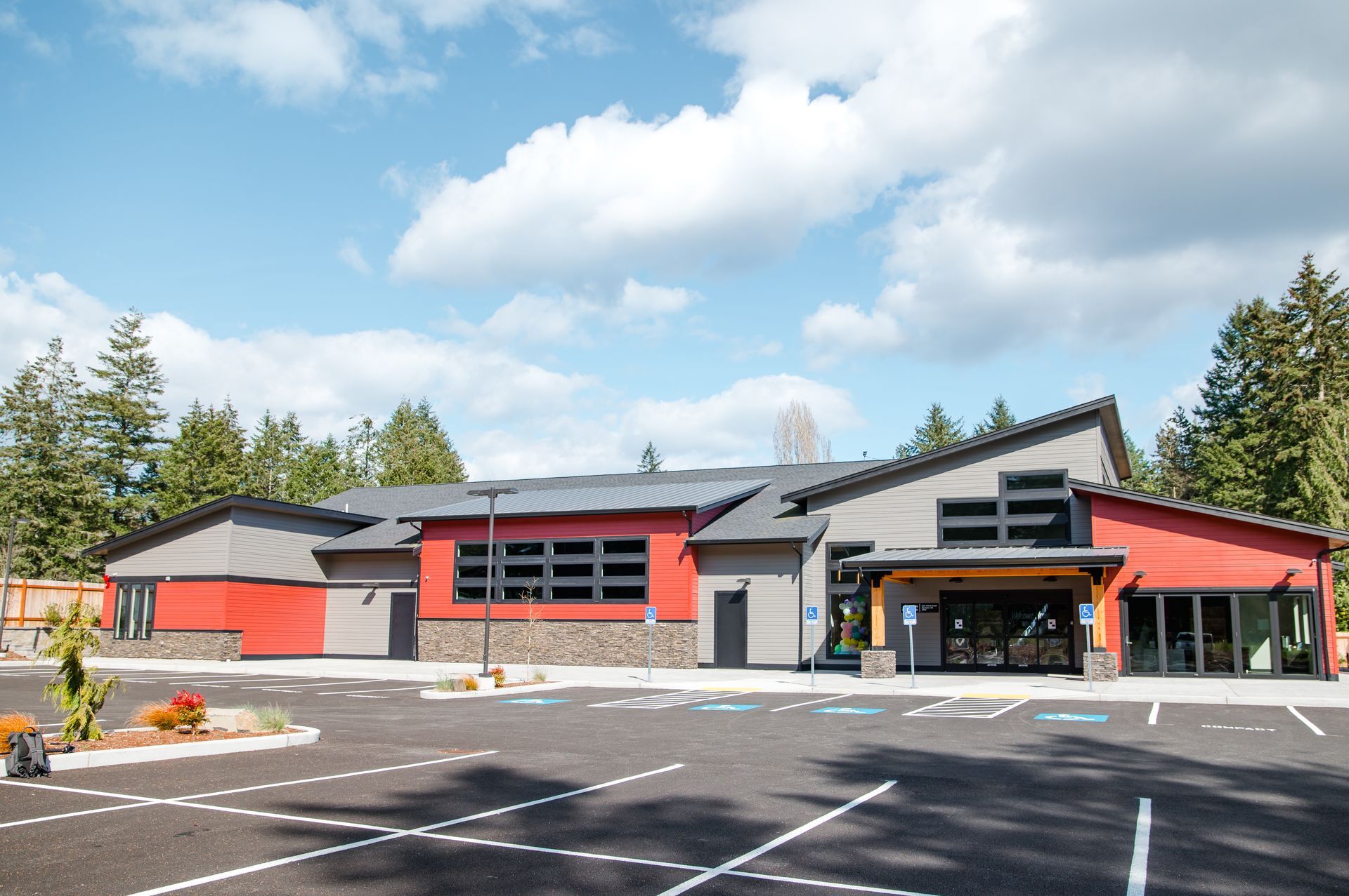 A large building with a parking lot in front of it.