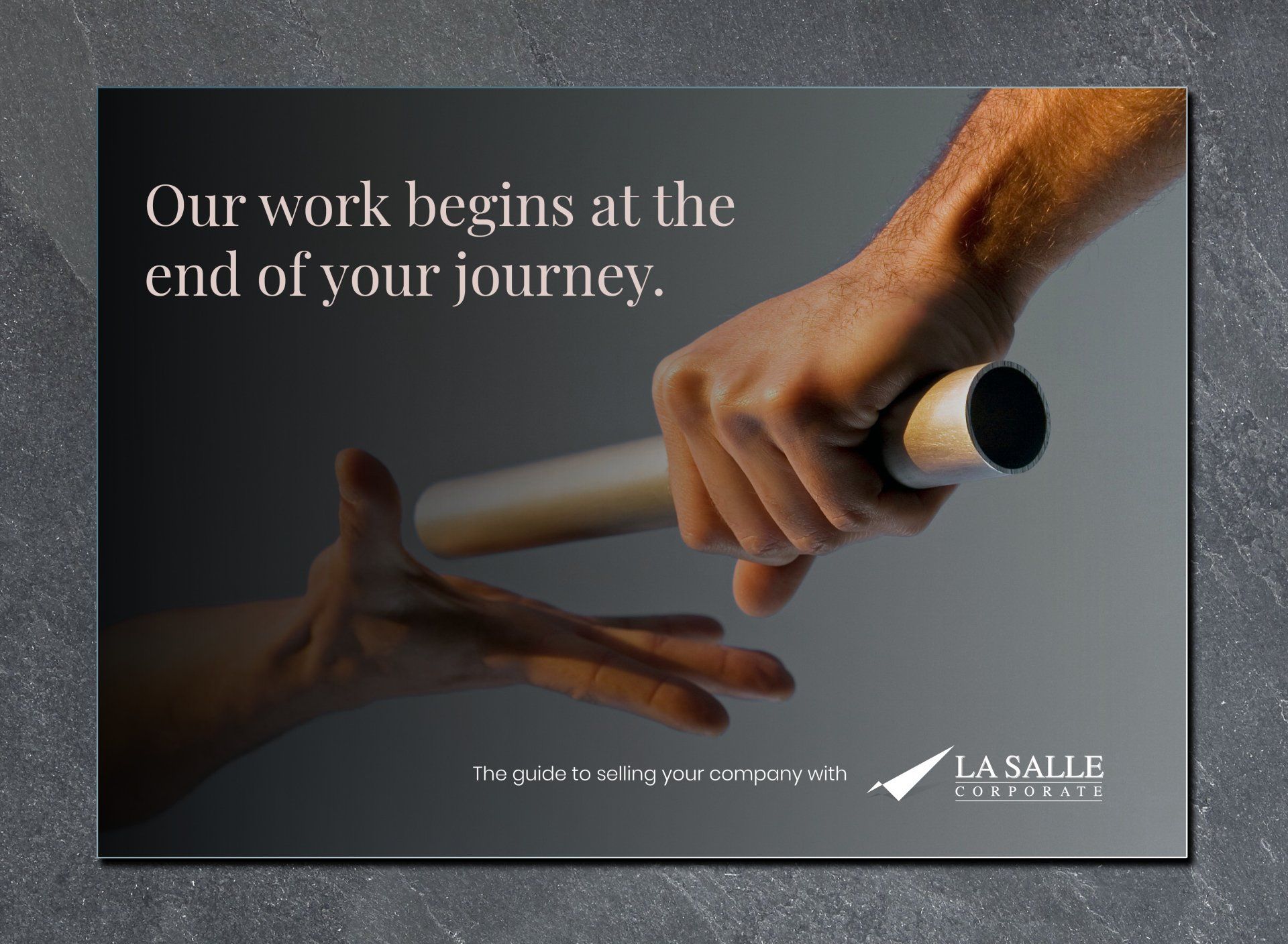 Hands passing a baton on a dark background, with the text “Our work begins at the end of your journey.”