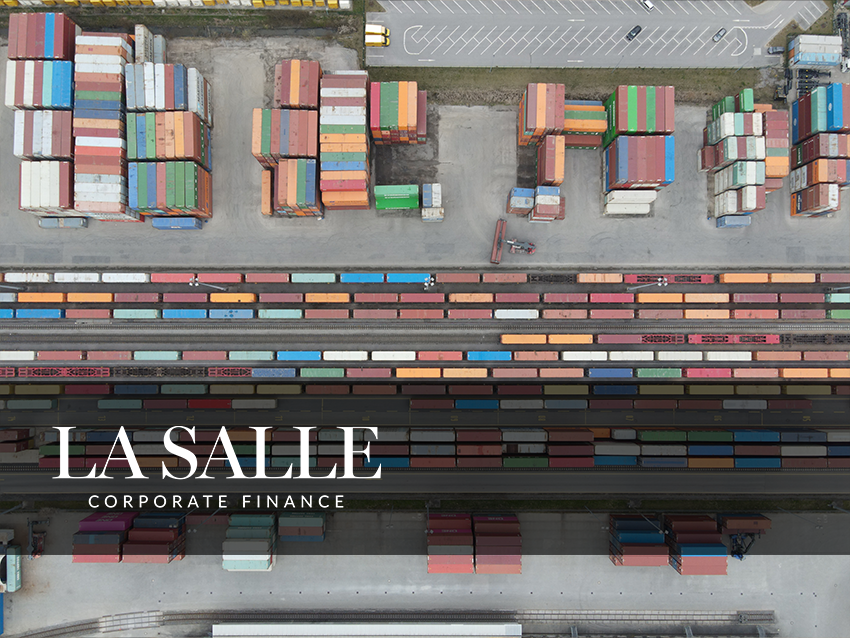Aerial view of stacked shipping containers with “LA SALLE Corporate Finance” text overlay