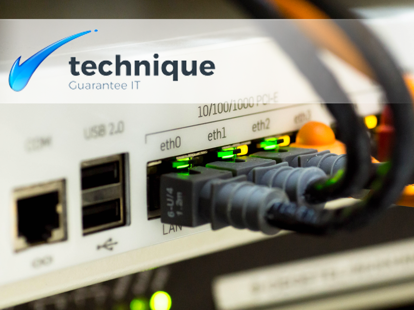 Close-up of network switch ports with plugged-in Ethernet cables and green status lights