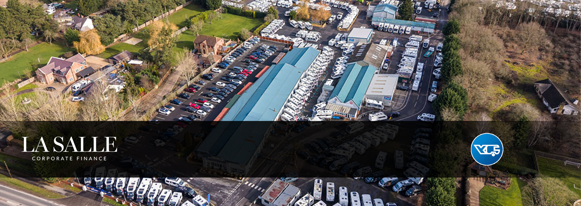 Aerial view of La Salle College’s waterfront campus buildings and courtyard.