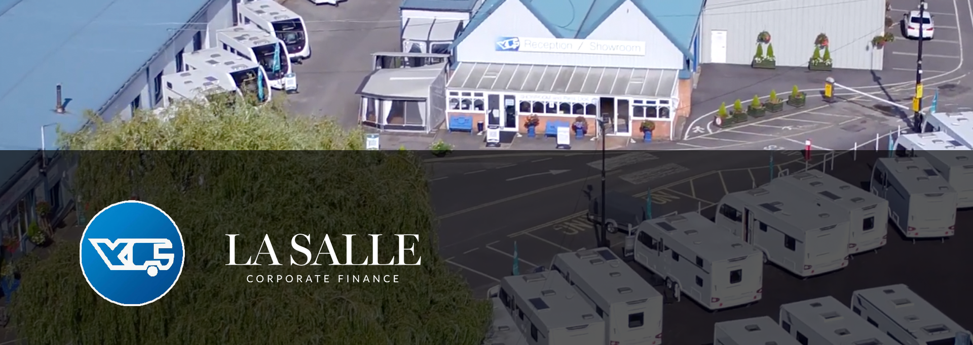 Aerial view of La Salle College’s waterfront campus buildings and courtyard.