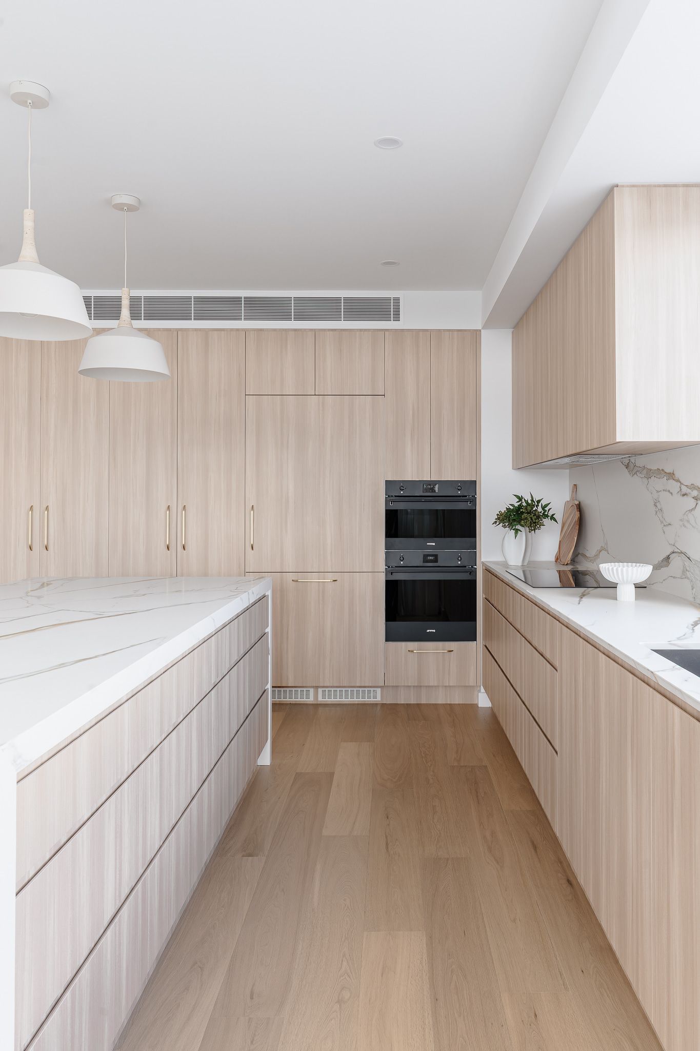 Modern Kitchen With Light Wood Cabinets — SDC Building Design In Kiama, NSW