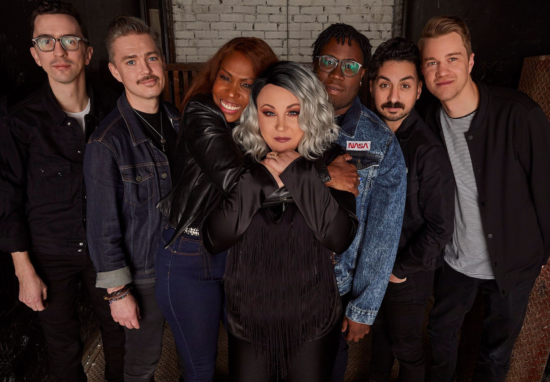 A group of people are posing for a picture together.
