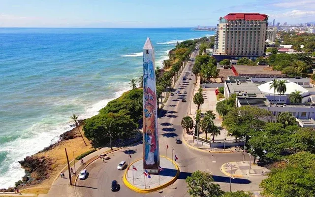 An obelisk on a roundabout along a coastal road in Santo Domingo, Dominican Republic