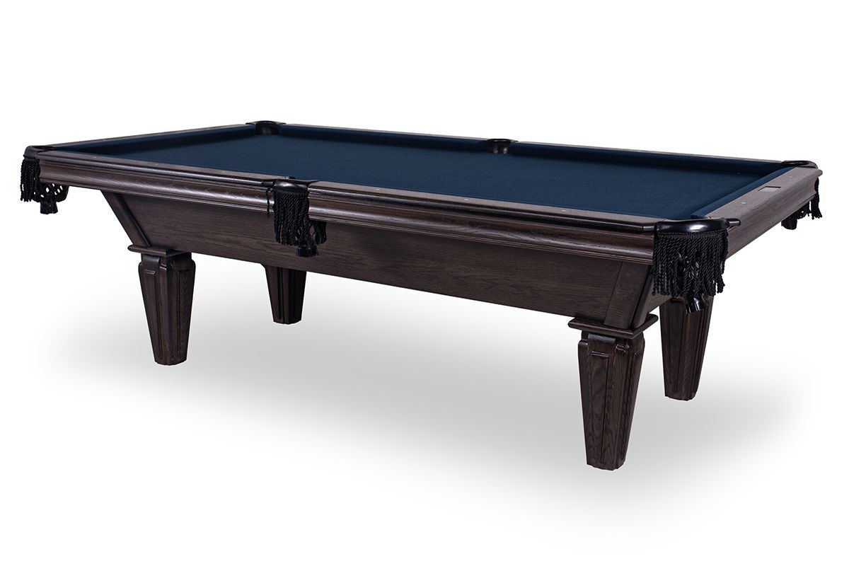 Dark wooden pool table with blue felt and carved legs on a white background