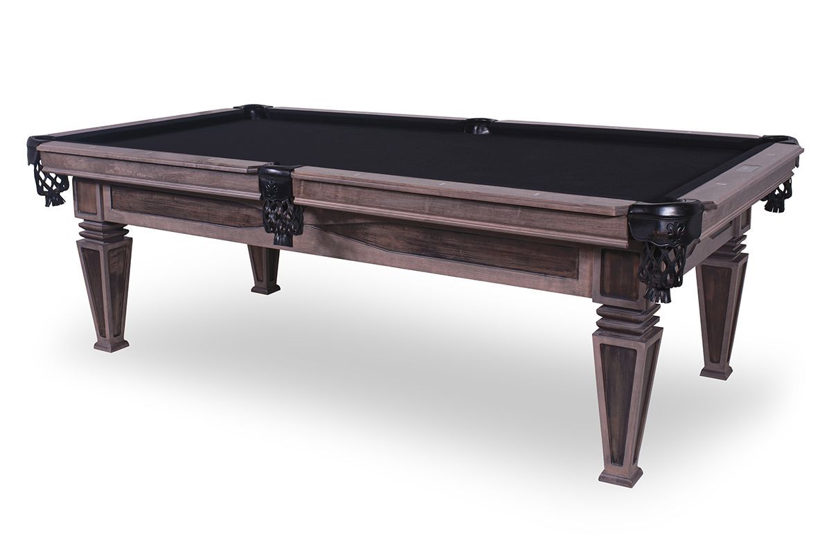 Wooden billiards table with dark green felt and ornate carved legs