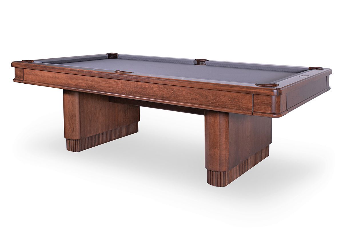 Wooden pool table with dark felt and four sturdy legs on a white background