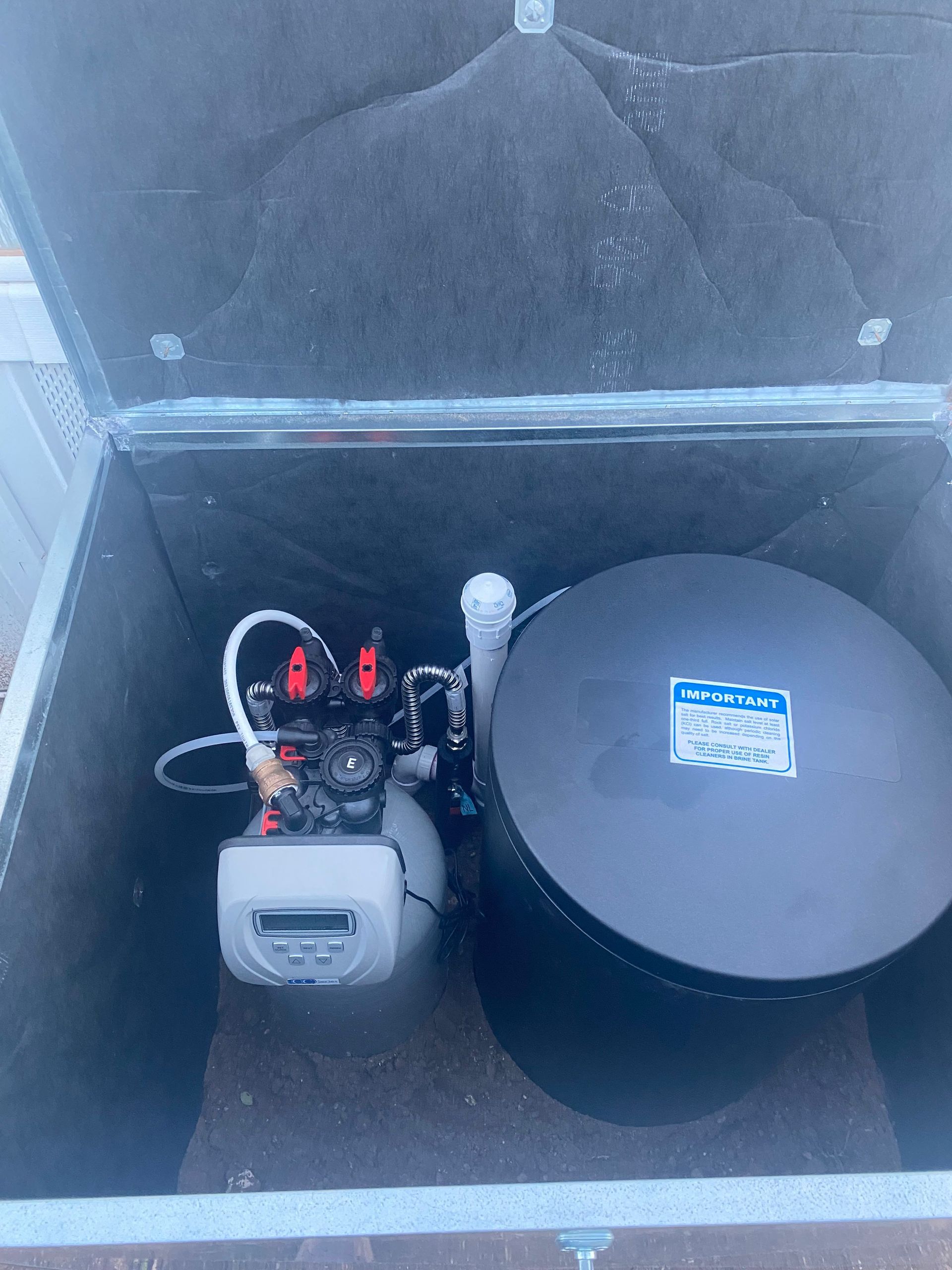 A black container with a sticker on it that says aqua bed