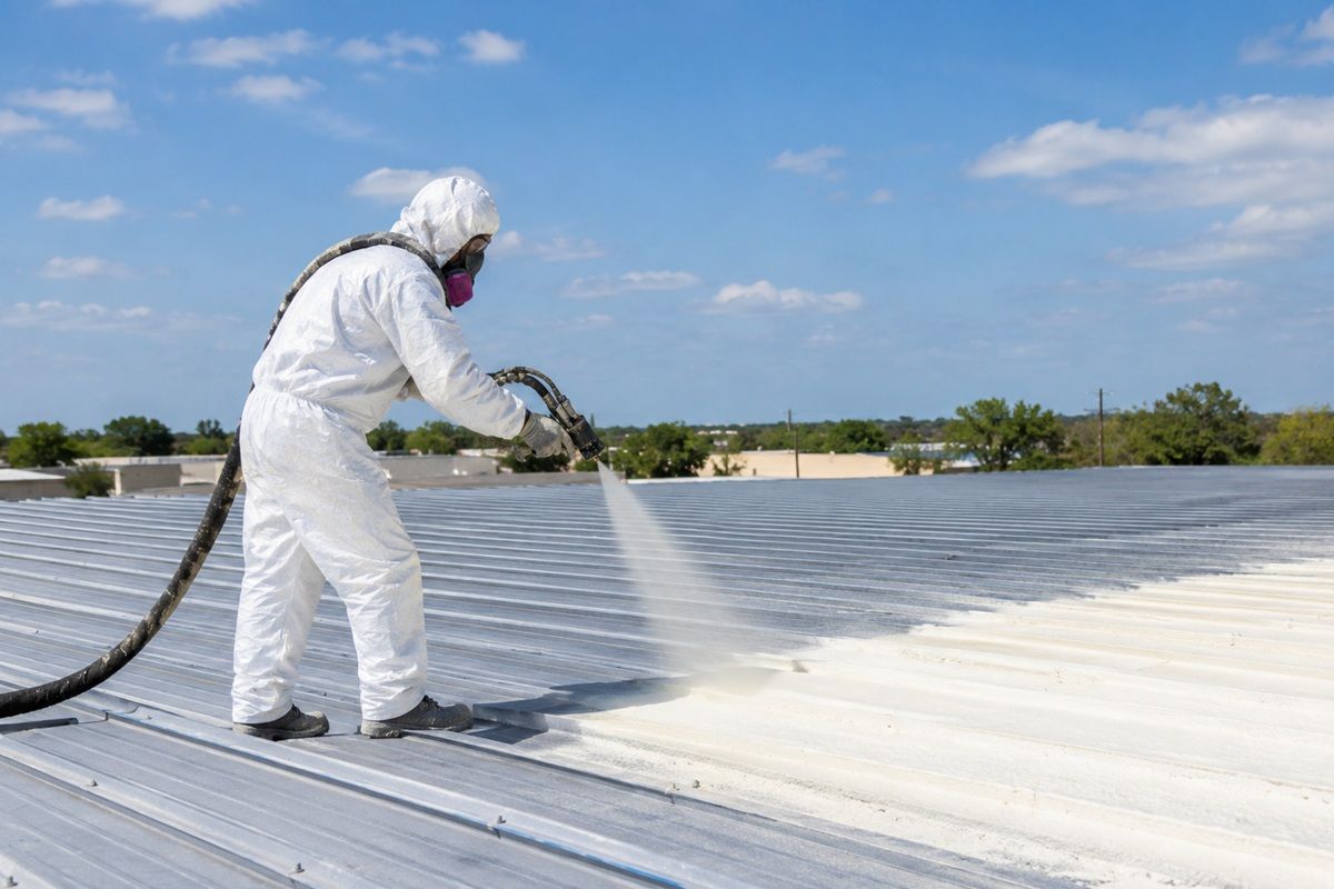 Commercial spray foam insulation contractor applying roof insulation in Mission TX.