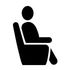 A man is sitting in a chair with his legs crossed.