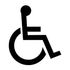 A black and white silhouette of a person in a wheelchair.