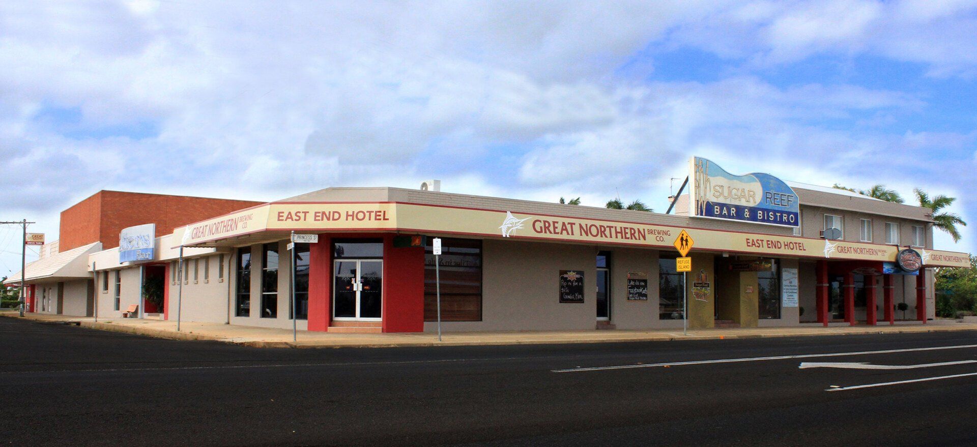 A large building on the corner of a city street