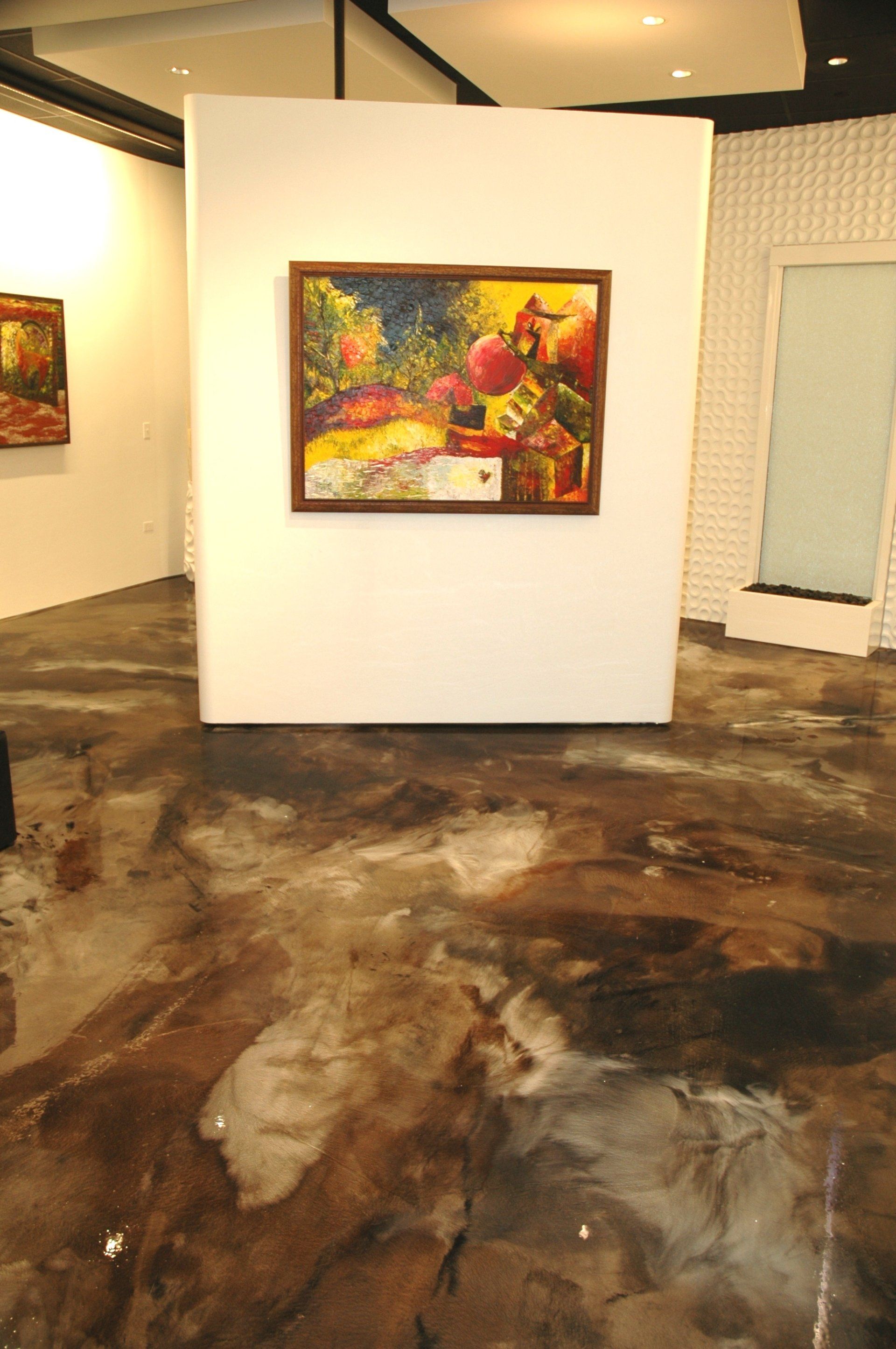 A painting is hanging on a wall in a room
